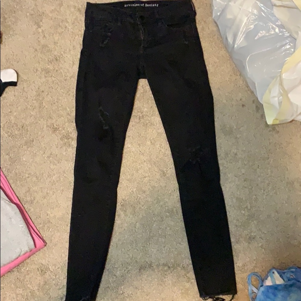 Black article of society ripped jeans